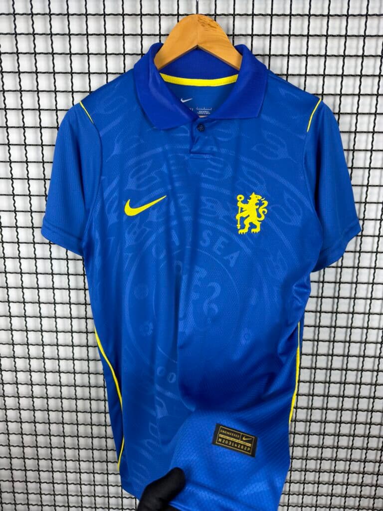 Camisa Chelsea Polo Azul 26/27 · Nacional Premium